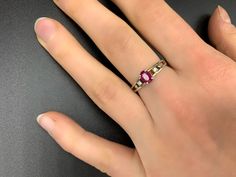 Handmade, antique ruby ring made of 925 silver. It was made in Germany in the 1960s and professionally reworked by a goldsmith in the 2000s. The ring has a 925 stamp inside and is set with a ruby (approx. 6 mm x 4 mm x 1.5 mm). It is size 16 (56 1/2 or 7 3/4 in USA/ PQ in UK). More precisely, the ring measures 19 mm x 19 mm x 2 mm on the inside at the narrowest point. The external dimensions of the ring are 21 mm x 24 mm x 6 mm. The ring weighs 12,410 carats. Upon request with a certificate of a Red Pink Sapphire Rings, Classic Pink Ruby Rings, Heirloom Pink Ruby Ring, Vintage Ruby Rings With Emerald Cut, Hallmarked Pink Ruby Rings, Ruby Diamond Promise Ring Hallmarked, Pink Ruby Ring Hallmarked, Vintage Emerald Cut Ruby Rings, Ruby Diamond Promise Ring