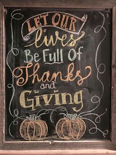 a chalkboard sign that says let our lives be full of thanks and giving with pumpkins