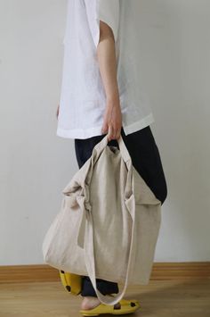 2 way messager bag.Adjustable strap.Self fabric handel.* Material: Washed heavy weight linen cotton blend.*Demention:  Approx 43cm / 17" (wide) X 39cm / 15.3" (Height)Handle: 16cm / 6.3"Don't hesitate to contact me with any question. Remember each piece is unique and handcrafted by EDOA.Thank you for your visit : ) Beige Hobo Bag For On-the-go, Beige Bucket Bag With Rolled Handles For Travel, On-the-go Beige Hobo Bag, Beige Hobo Shoulder Bag With Rolled Handles, Beige Satchel Bucket Bag With Rolled Handles, Versatile Beige Bags With Rolled Handles, Beige Tote Duffle Bag With Removable Pouch, Everyday Beige Canvas Bag With Rolled Handles, Beige Hobo Travel Bag