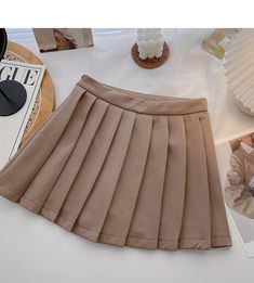 Waist type: high waist Size: S M L XL Color: khaki, black Beige Solid Color Skirt For Fall, Solid Color Beige Skirt For Fall, Solid Beige Skirt For Fall, Trendy High Waist Beige Skirt, Casual High Waist Solid Color Tennis Skirt, High Waist Khaki Skirt For Fall, Trendy High Waist Khaki Skirt, Beige Spring Skort For School, Fall High-waist Khaki Skirt