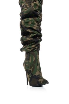 The AZALEA WANG Greer Camo Boot is an edgy, trendy boot crafted from a camo denim textile upper with an ultra-scrunched textured knee-high shaft, a pointed toe silhouette, a slim stiletto heel, and a soft faux suede inner lining. Complete with an inner ankle zipper closure.  (all measurements are approximate from size 7.5) - Textile Upper - Pointed Toe - Knee-High Shaft Height - 4.5” Stiletto Heel - 19.75” Shaft Height - 15” Circumference - Imported  Product ID: 361413 Camo Boots, Girl Boots, All White Party, Azalea Wang, Trendy Boots, White Accessories, Big Girl, Girls Boots, White Shoes