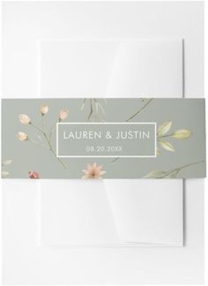 a wedding card with flowers on the front, and a white envelope in the back