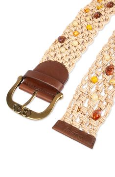 Add a flourishing touch to any look with this ornate belt knotted from raffia straw and embellished with multicolored beads and smooth leather trim. Raffia straw with leather trim Imported Beige Woven Belts For Spring, Spring Beige Woven Belt, Beige Woven Belt For Vacation, Casual Woven Belts For Spring, Casual Beige Belts For Vacation, Adjustable Brown Belts For Beach, Adjustable Woven Beige Belt, Adjustable Woven Belt For Summer, Casual Brown Woven Belt