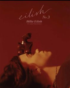 a woman laying down with a pair of shoes on top of her head and the words eliish no 3 above her head