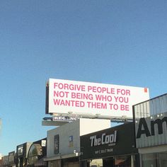 an advertisement on the side of a building that says, forging people for not being who you wanted them to be