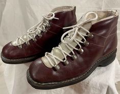 Beautiful burgundy 1950s/60s ski boots - size 38 (US women's 7.5).  Made in Finland and recently acquired there on a buying trip.  These warm, lined boots will be great for display or as part of a vintage ski kit.  Pair of brown laces also included, so you can swap out the colour. NOTE: if you decide to use these to ski, these boots will work best with "cable-type" bindings, sometimes referred to as "Kandahar" bindings (see picture; bindings not included).  The boots have been used with traditio Ski Vintage, Burgundy Colour, Short Rain Boots, Vintage Ski, Moon Boots, Snow Sports, Cross Country Skiing, Ski Boots, Christmas Gifts For Women