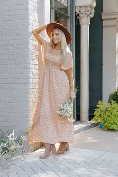 Experience the ultimate combination of style and comfort with our Clay Print Smocked Maxi Dress! This fully lined dress features a beautiful allover print, short sleeves, and a flattering smocked bodice. The button front detail adds a touch of elegance to this maxi length dress. Made of 100% polyester for a luxurious feel. Style with ankle booties, a wide brim hat, and matching accessories for a chic fall outfit!