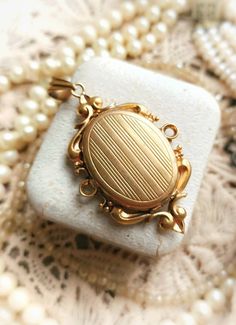 "Beautiful French Antique c1900s Gold Plated Ornate Victorian Locket Antique Photo Holder Pendant, Gift for Woman Size -  Medallion itself (inside of an inner oval part - place for a photo, without a frame) - approx. 23,5x16,5mm / 0,92\" x 0,65\" Size without a bail (with decorative frame) - approx. 42,5x28,7mm / 1,67\" x 1,13\" Total lenght (with bail) - approx.  53mm / 2,08\" Width - approx. 6,5mm / 0,25\" Pendant is in a great antique condition, very thick and high quality, gold plated, shiny and beautifully decorated with a big ornate frame. Inside it has a place to hide two photos or maybe dried flowers, piece of fabric, little painting..  Pendant has a few signs of age, as you can see on photos, especially on the back - some scratches and a delicate gold layer wear, but overall it's Luxury Victorian Locket Necklace, Luxury Antique Engraved Locket Necklace, Antique Victorian Jewelry, Antique Baroque Jewelry For Wedding, Victorian Oval Jewelry With Historical Design, Vintage Yellow Gold Jewelry With Historical Design, Vintage Baroque Jewelry With Historical Design, Vintage Ceremonial Jewelry With Historical Design, Ceremonial Vintage Jewelry With Historical Design