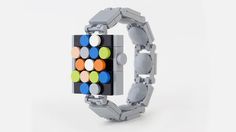 a bracelet made out of legos with different colored balls on the front and sides