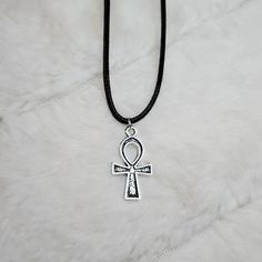 Small Ankh Charm Necklace. Charms Are Approximately 25x14mm. Comes On A 17.5inch Black Rope Cord With A Lobster Clasp And 1.5 Inch Extension Chain. #Ankh #Egypt #Cross #Charm #Necklace Black Ankh Metal Jewelry, Ankh Shaped Black Metal Necklace, Black Ankh Necklace In Metal, Adjustable Silver Cross Charm Necklace, Adjustable Ankh Black Necklace, Black Ankh Jewelry For Gifts, Adjustable Silver Ankh Necklace, Cross Charm Necklace, Necklace Charms