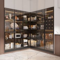 an open glass cabinet in the middle of a kitchen