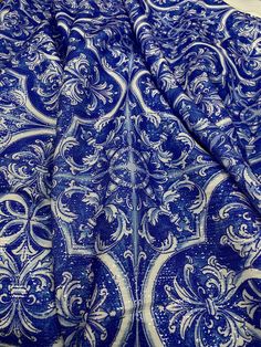 a blue and white paisley print fabric