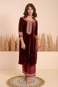 Maroon three fourth sleeves velvet A-line kurta with plumeria bloom embroidery and tonal sequins encrustments detail. Paired with a matching bloom border silk chanderi pant. - Aza Fashions Traditional Velvet Long Sleeve Salwar Kameez, Festive Velvet Long Sleeve Sets, Festive Velvet Kurta With Dabka Embroidery, Velvet Palazzo Set With Resham Embroidery For Eid, Bollywood Velvet Sets With Long Sleeves, Embroidered Velvet Palazzo Set, Velvet Straight Kurta With Zari Work, Unstitched Velvet Kurta For Festive Occasions, Velvet Long Sleeve Salwar Kameez With Resham Embroidery