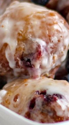 blueberry donuts with icing in a white bowl