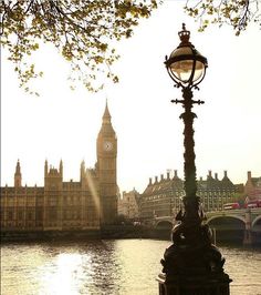 the big ben clock tower towering over the city of london, england in the background