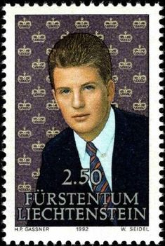 a stamp with a portrait of a man wearing a suit and tie, on a purple background