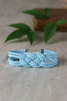 Delicate light blue summer knot bracelet created from decorative twisted rope and clasp in silver tone metal. Perfect jewelry for everyday wear! Length: 17 -18 cm + 6 cm of chain (If you need other size,please,let me know). A wonderful jewelry and a great gift! I made it in a smoke-free and pet-free invironment. Other bracelets of my shop you can see here: https://www.etsy.com/shop/NaTavelli?section_id=13470528 Thanks for your visit! Nautical Blue Bracelets As A Gift, Nautical Blue Bracelets For Gifts, Adjustable Blue Nautical Jewelry, Light Blue Bracelet, Bracelet Knot, Sailor Knot Bracelet, Navy Adjustable Nautical Bracelet, Nautical Rope Bracelet, Sailor Knot