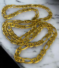 14K HEAVY Solid Yellow Gold 24" 5.5mm FIGARO CHAIN Necklace 28.8 Grams! Beautiful solid 14k (585) yellow gold FIGARO chain! * 14k Yellow gold * Hallmarked 14k * Approximately 5.5mm width * Weight: 28.8 grams * Secure lobster claw closure * Measures approximately 24" long measured flat from end to end. Ships FAST and FREE, in a gift box fully insured :) Please shop with confidence! I guarantee item to be exactly as described and pictured. Luxury Statement Figaro Chain Jewelry, Luxury Gold Jewelry With Figaro Chain, Luxury Hand-strung Yellow Gold Jewelry, Luxury Yellow Gold Statement Necklace, Luxury Vintage Figaro Chain Necklace, Luxury Heirloom Figaro Chain Necklace, Elegant Luxury Long Yellow Gold Necklace, Luxury Gold Plated Jewelry With Figaro Chain, Luxury Gold Plated Figaro Chain Jewelry