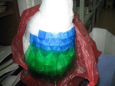 a plastic bottle wrapped in red, white and blue material