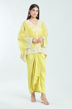 Yellow semi-sheer short tunic with contrast floral embroidery. Comes with solid draped skirt and inner blouse. - Aza Fashions Organza Blouse With Traditional Drape, Traditional Draped Skirt For Wedding, Elegant Pre-draped Saree For Spring, Elegant Draped Floral Embroidery Sets, Draped Sets With Floral Embroidery In Georgette, Traditional Pre-draped Saree For Spring, Georgette Draped Dress With Floral Embroidery, Draped Georgette Dress With Floral Embroidery, Floral Embroidered Draped Georgette Dress