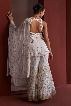 White peplum kurta featuring dabka embroidered floral blossom patterns highlighted by pearls. Comes with embroidered floral jaal embroidered sharara and dupatta. - Aza Fashions Kurta And Sharara, Embroidered Sharara, Women Kurta, White Peplum, Fashion App, Set Women, Aza Fashion, Blossom, Floral