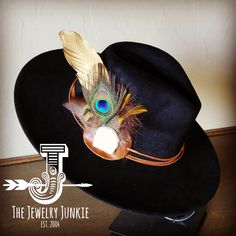 If you’re looking for the perfect accessory to complement your favorite boho style, look no further. This Boho-Style Western Felt Hat w/ Natural Feather & Turquoise Hat Accent by The Jewelry Junkie is absolutely everything that you need. Not only is it easy to incorporate into any and all outfits, but the genuine leather and natural feathers of the band immediately elevate whatever it is you’re wearing. One Size Hat with adjustable inner hat liner (see last photos) The same primary feathers will Bohemian Adjustable Hat Band With Feathers, Bohemian Mini Hat With Feathers, Adjustable Felt Hat With Feathers For Festivals, Bohemian Feather Hat Band For Fall, Artisan Hats With Feathers And Adjustable Fit, Bohemian Fedora Hat Bands With Feathers, Handmade Bohemian Hat Bands For Kentucky Derby, Bohemian Adjustable Felt Hat With Feathers, Bohemian Mini Hat With Feathers For Festivals