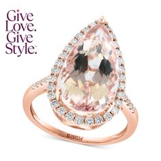 an engagement ring with a large pear shaped morganite in the center and diamonds surrounding it