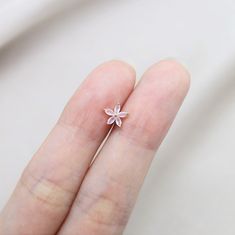 ⇢⇢ PLEASE READ BEFORE PURCHASING ⇠⇠ ✧✧ This listing is for ONE piece only ✧✧ PLEASE BE AWARE of your own ear piercing size!! Everyone has different sizes and shaped ears, with different gauge sizes, so our suggestion may NOT be for everyone. 💜 Item Details 💜 ✧ 1 Piece ✧ Thickness: 16 Gauge (1.2mm) ✧ Top Size: 5mm ✧ Material: Surgical Steel ✧ Externally Threaded ✧ For: Cartilage, Tragus, Helix, Conch ✧ Ball Back (4mm) ✧ If you wanted a 3mm ball end (Silver color only), please leave me a note wh Minimalist Flower Shaped Pierced Jewelry, Dainty Pierced Rose Gold Flower Earrings, Dainty Rose Gold Pierced Flower Earrings, Flower Cartilage Earrings For Pierced Ears As Gift, Flower Shaped Cartilage Earrings For Gift, Dainty Rose Gold Cartilage Earrings Gift, Gift Flower Cartilage Earrings, Tiny Rose Gold Flower Shaped Jewelry, Delicate Tiny Flower Shaped Jewelry