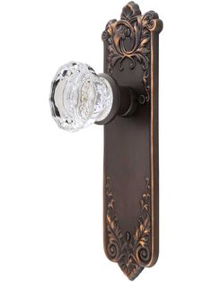 an ornate door handle with a glass knob