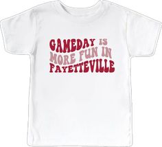 School Spirit Letter Print T-shirt For Game Day, Fan Apparel Tops With Lettering For Game Day, Game Day Fan Apparel Top With Lettering, Collegiate Tops With Lettering For Game Day, White Fan Gear Top With Lettering, Team Spirit Tops With Lettering For Game Day, Cotton Tops With Lettering For Game Day, Team Spirit Tops With Lettering For Fan Merchandise, White T-shirt With Sports Lettering