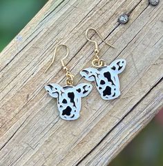 Wrapped with charm and whimsy, these boho cow earrings are a delightful accessory for any animal lover. The intricate design captures the essence of the gentle bovine with a modern twist. Crafted elegantly to dangle gracefully, these earrings are perfect for adding a touch of fun to your outfit. The cow-shaped charms bring a playful element, making them a unique conversation starter. Whether you're heading to a casual outing or a bohemian-themed event, these cow dangle earrings are a quirky addition to your jewelry collection. Embrace your love for nature and animals with these adorable cow earrings that seamlessly blend style and personality. *Gold hardware ear hooks are made of stainless steel *The cow charms are made of alloy material Cow Jewelry, Cow Print Earrings, Cow Earrings, Unique Dangle Earrings, Lover Jewelry, Whimsical Gifts, Lightweight Earrings, Jewelry Unique, Light Weight Earrings