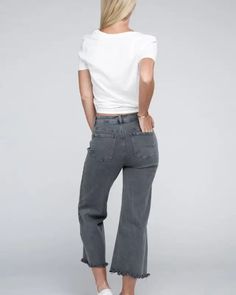 Elevate your denim game with our Acid Washed High Waist Frayed Hem Straight Pants. The high waist design not only adds a trendy touch but also ensures a flattering fit. Crafted from denim with a good stretch, they provide exceptional comfort for all-day wear. The zip fly and back pockets offer both functionality and fashion, making these pants a practical choice for any occasion. With their frayed hem and straight wide leg, these pants are a must-have addition to your wardrobe, delivering a mode