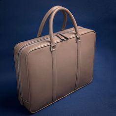 Handmade Epsom Leather Briefcase  Materials: Epsom Leather, Hermes Herringbone Fabric Lining, Excella Zipper, Stainless Steel Hardware. Size: 15x11x3.5(inch)38x28x9(cm), handle drop 4.7 inches/12cm About the leather: Epsom: Epsom is an embossed leather, which means the pattern pressed into the leather is not actual grain.  However, the pressed grain provides some major benefits, such as remarkable durability, scratch resistance, and easy maintenance.  Furthermore, Epsom is quite structured and h Elegant Brown Briefcase As A Gift, Beige Rectangular Briefcase For Business, Designer Rectangular Briefcase With Smooth Grain, Designer Smooth Grain Rectangular Briefcase, Modern Beige Briefcase For Business, Luxury Beige Formal Briefcase, Luxury Leather-lined Briefcase For Gift, Luxury Leather-lined Briefcase As A Gift, Beige Rectangular Formal Briefcase