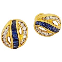 Charles Krypell Jewelry is a New York Based fine jewelry brand that became internationally known for its exquisite use of color, novel designs, and outstanding craftsmanship. These earrings are set with round brilliant diamonds and invisibly set baguette blue sapphires. The earrings are approximately 5/8". They are clip on, but posts may be added. Diamond weight 1.16 carats Sapphire weight 2.30 carats Stamped Krypell 750 Appraisal upon request from Cellini NYC Yellow Gold Earrings, Jewelry Brand, Yellow Gold Earring, Jewelry Branding, Indian Jewelry, Round Brilliant, Rose Gold Ring, Blue Sapphire, Clip On Earrings