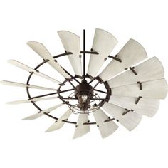 an old fashioned windmill style light fixture with white blades hanging from it's ceiling