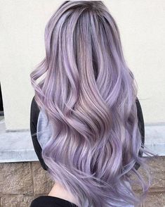 the back of a woman's head with purple hair