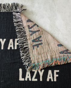 two black and white rugs with the words yaf lazy af on them