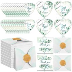 thank you cards and envelopes with gold coins in the shape of hearts on white background