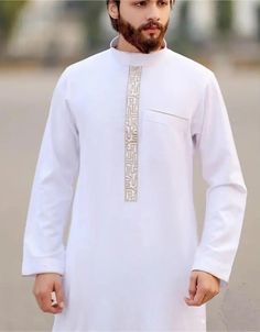 This Polyester Jubba Thobe in pristine White is designed for the discerning individual. With its broadcloth fabric and adult-specific fit, it guarantees both comfort and durability. Whether you're attending casual gatherings or enjoying a day out, this thobe effortlessly adapts to the occasion, ensuring you look stylish and feel at ease throughout the year. Processing Time : 20-25 Business Days Material: Expertly crafted from high-quality polyester for a blend of comfort and durability. Item Typ White Long Sleeve Thobe With Intricate Embroidery, Elegant White V-neck Thobe, White Thobe Men, Casual White Long Sleeve Thobe, Casual Cotton Long-sleeved Thobe, Muslim Men, White Elegance, Hijab Scarf, Moroccan Caftan