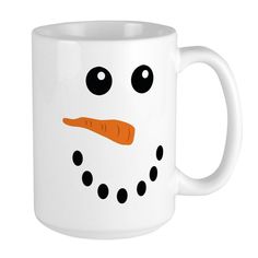 a white mug with a snowman's face drawn on it