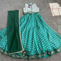 Mint Green /Cream/Yellow Lehenga With Gold Sequin Blouse . Sleeveless Cotton Skirt With Lining And Can Can Elastic Back Waistband With Side Hook And Zipper Matching Soft Net Dupatta Blouse With Back Hooks Cotton Pista Green Dress For Festivals, Pista Green Cotton Dress For Festivals, Green Cotton Dress With Zari Work, Green Cotton Wedding Sets, Green Cotton Lehenga For Navratri, Green Cotton Lehenga For Wedding, Green Dupatta For Festivals, Festive Green Cotton Lehenga, Cotton Self-design Dress For Wedding