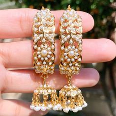 jadau dandi jhumki Traditional White Pearl Earrings For Reception, White Danglers With Intricate Design For Reception, Traditional Pearl Drop Earrings For Reception, White Jhumkas For Reception And Festivals, White Jhumkas For Diwali Reception, Festive Chandbali Jhumkas In Elegant Style, Elegant Chandbali Jhumkas With Tilla Details, Elegant Chandbali Jhumkas With Tilla, Festive Chandbali Jhumkas