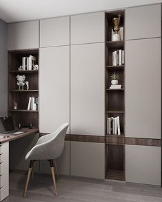 an office with a chair, desk and bookcases on the wall next to it