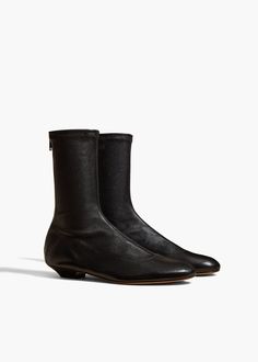 A sleek boot shaped by softened lines, including a rounded toe inspired by that of the classic ballet flat. With back zipper. Leather Outerwear, Wardrobe Edit, Ankle Boots Flat, Denim Shoes, Boot Pumps, Belt Accessories, Pumps Flat, Flat Boots, Ballet Flat