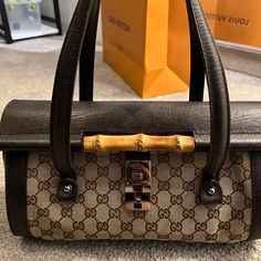 Authentic Gucci Barrel Bamboo Bag Gently Used. Shows Signs Of Wear On The Corners Of The Bag Please See Photos Inside Is Still Clean. A Vintage Piece To Call Your Own :) Comes With The Dust Bag No Controlla Card As I Purchased It Many Years Ago. Bamboo Bag, Barrel Bag, Gucci Bamboo, Gucci Bags, Barrel, Dust Bag, Bamboo, Bag Lady, Gucci