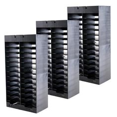 three metal shelving units sitting next to each other on top of a white background