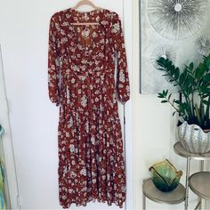 Great Spell Boho Maxi Hi-Low Dress Burnt Ember Floral Print Size Xs. Loaty 3 Tiers Frills From The Waist, Curved V Neckline, Long Sleeve , Elastic Cuff, Hi-Low Maxi Length, Buttons Front, Drawstring Waist, Front And 1/2 Skirt Lined. Great Used Condition, No Notable Flaws. Tags: Boho, Bohemian,Victorian, Event, Special Occasion, Casual. Rust, Cream And Black Floral Print. Chest: 17" Length: Front Lenght 36'', Back 38'' Sleeve 23'' Waist: Drawstring Waist 15'' Shoulders 14'' All Measurements Appro Bohemian Ditsy Floral Maxi Dress For Brunch, Long Sleeve Ditsy Floral Maxi Dress For Garden Party, Bohemian Ditsy Floral Print Daywear Dresses, Bohemian Ditsy Floral Print Dress For Daywear, Bohemian Ditsy Floral Print Day Dress, Bohemian Ditsy Floral Print Dress For Brunch, Brown Boho Long Sleeve Dress For Spring, Brown Long Sleeve Boho Dress For Spring, Maxi Boho Dress With Floral Print For Brunch