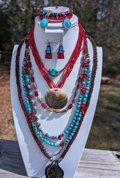 This lot includes Necklaces, bracelets and earrings. They are made up of turquoise,Coral and Murano Glass.They compliment each other exquisitely.You can wear them separately or together. It makes a great conversation starter and you are definitely to stand out with these complimentary pieces. Handmade Turquoise Bohemian Jewelry Sets, Handmade Bohemian Turquoise Jewelry Sets, Red Southwestern Style Jewelry Gift, Southwestern Style Red Jewelry For Gift, Southwestern Style Red Jewelry For Gifts, Bohemian Turquoise Jewelry Sets For Gifts, Southwestern Multi-strand Colorful Beads Jewelry, Southwestern Multi-strand Jewelry With Colorful Beads, Unique Multi-strand Turquoise Jewelry