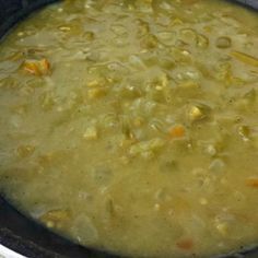 a pot filled with soup sitting on top of a stove