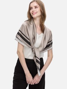 The Silk Duo Wrap is the ultimate versatile piece for breezy layering. Made from 100% silk, it effortlessly transitions from a chic wrap to an elegant scarf. Its oversized cut and minimal hem detail offer a relaxed feel, combining comfort and style seamlessly. 100% Silk: Crafted from 16 momme silk, it boasts a smooth, pearl-like gloss that drapes beautifully. All-Season Comfort: Breathable, hypoallergenic, and moisture-retaining, it's perfect for sensitive skin. Versatile Elegance: The 2-in-1 de Elegant Shawl For Layering, Chic Beige Silk Scarf, Elegant Wrap Shawl For Layering, Chic Spring Wrap Shawl, Classic Silk Scarf For Spring Workwear, Chic Silk Scarves For Spring, Elegant Beige Scarves For Workwear, Chic Beige Shawl For Spring, Elegant Summer Scarves For Workwear